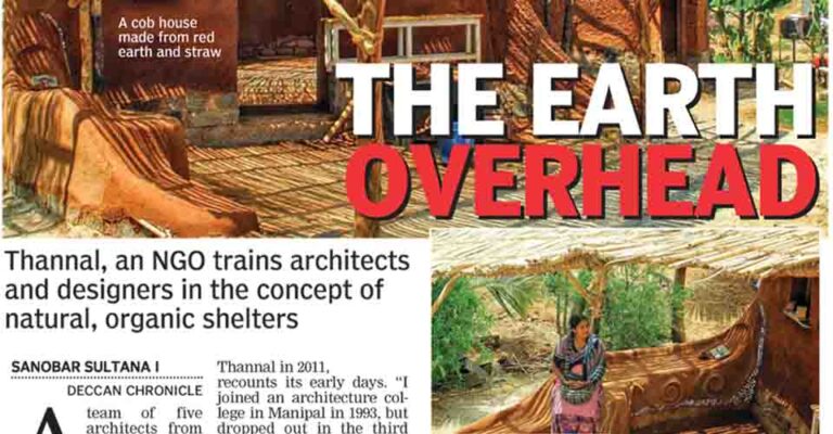 Deccan Chronicle 'The Earth Overhead' feature on Thannal Natural Homes — a cob house with a bamboo roof frame and Sindhu Bhaskar seated on a curved cob bench.